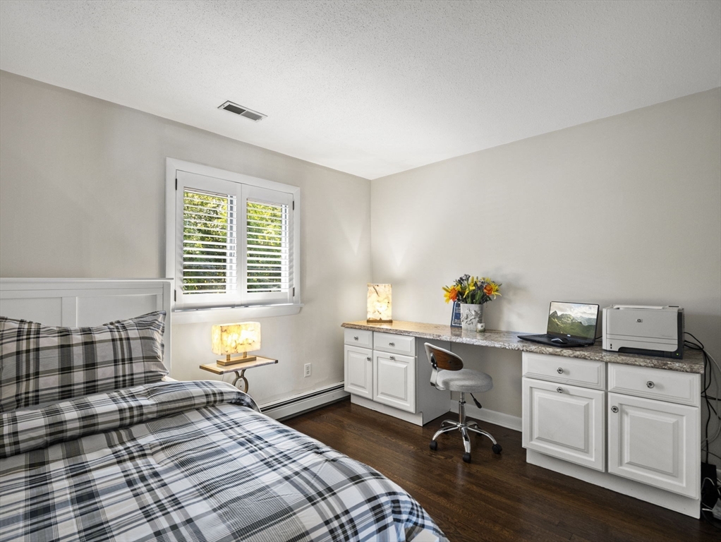 15 North Street Andover, MA 01810 - Photo 25 of 42 a bedroom with a bed and large windows