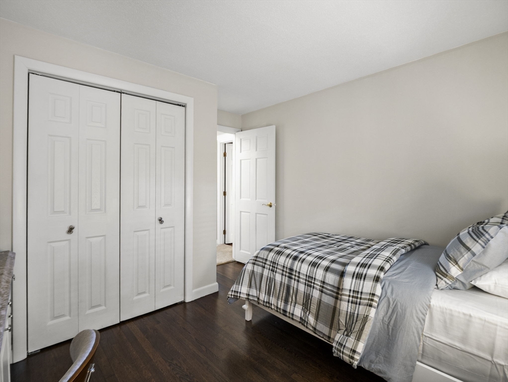 15 North Street Andover, MA 01810 - Photo 26 of 42 a bedroom with a bed and wooden floor