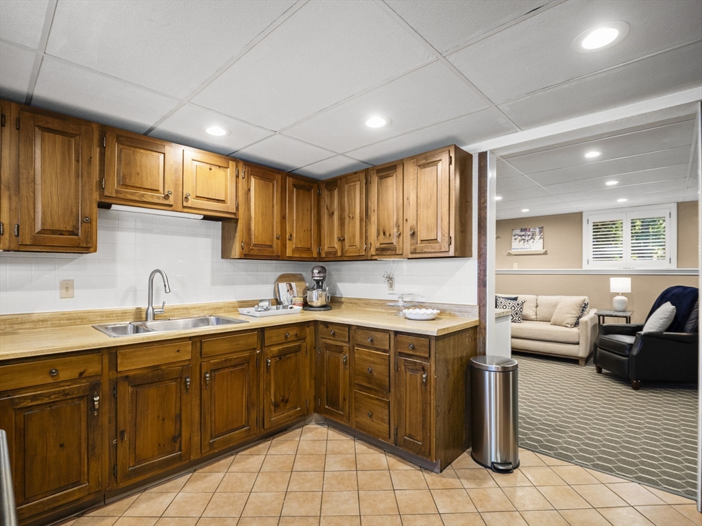 15 North Street Andover, MA 01810 - Photo 29 of 42 a kitchen with a sink window and cabinets