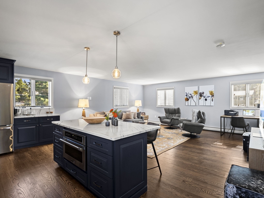 15 North Street Andover, MA 01810 - Photo 31 of 42 a living room with furniture and wooden floor