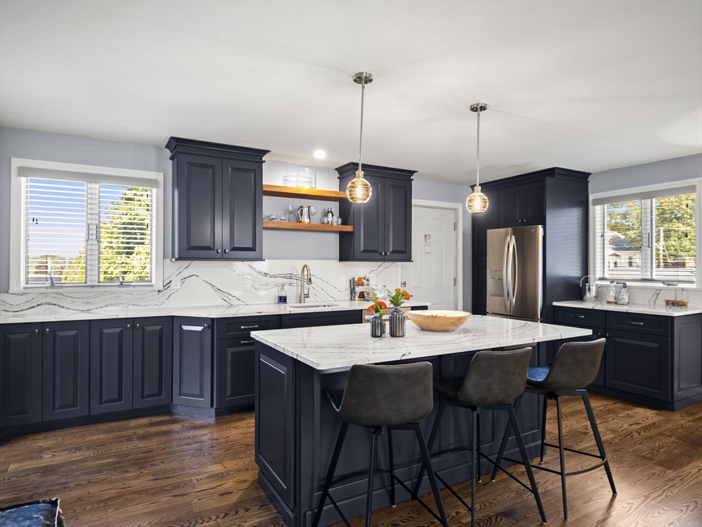 15 North Street Andover, MA 01810 - Photo 32 of 42 a kitchen with a dining table chairs and sink