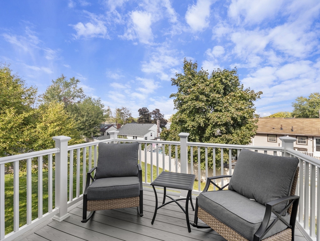 15 North Street Andover, MA 01810 - Photo 36 of 42 a view of a chair and table on the terrace