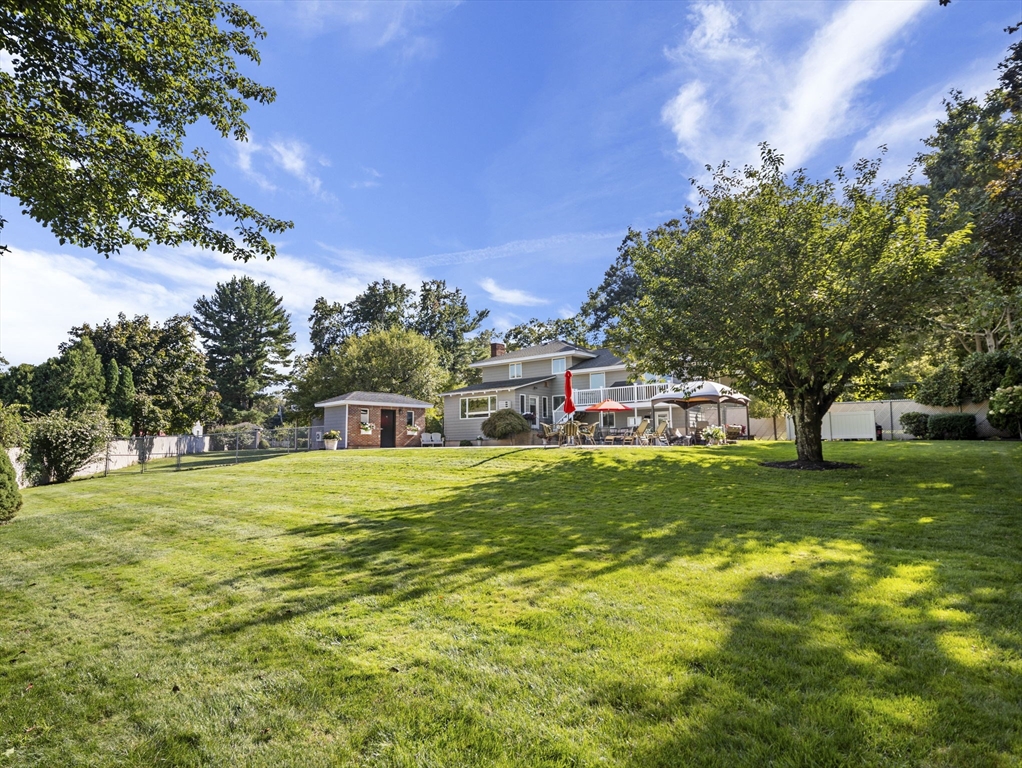 15 North Street Andover, MA 01810 - Photo 42 of 42 a small pool with a big yard and large trees