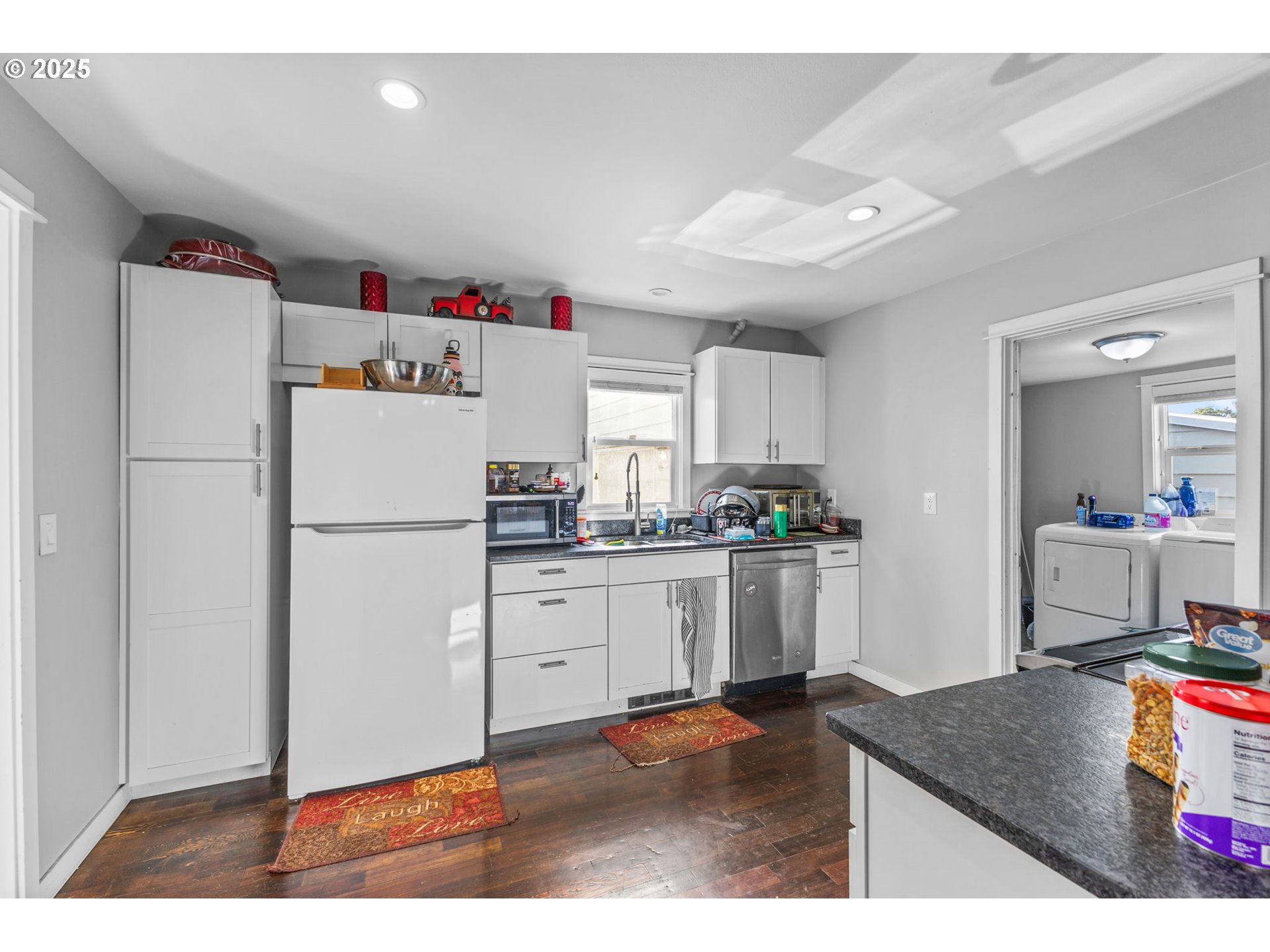221 Southwest Rainbow Avenue Dallas, OR 97338 - Photo 11 of 36 a kitchen with refrigerator and cabinets