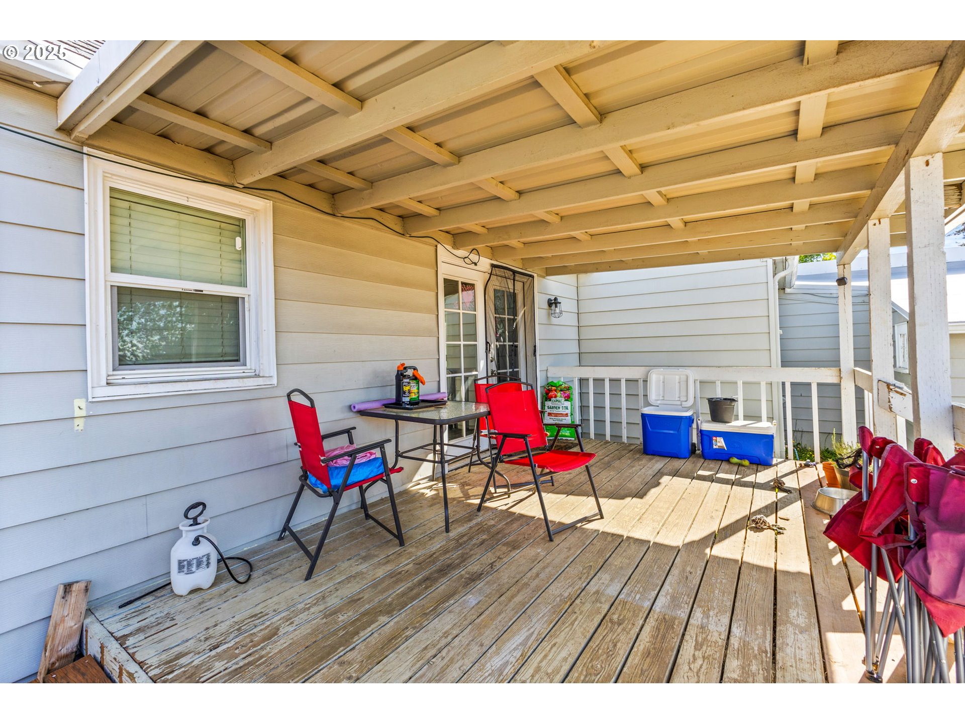 221 Southwest Rainbow Avenue Dallas, OR 97338 - Photo 27 of 36 a view of a patio with table and chairs and wooden floor