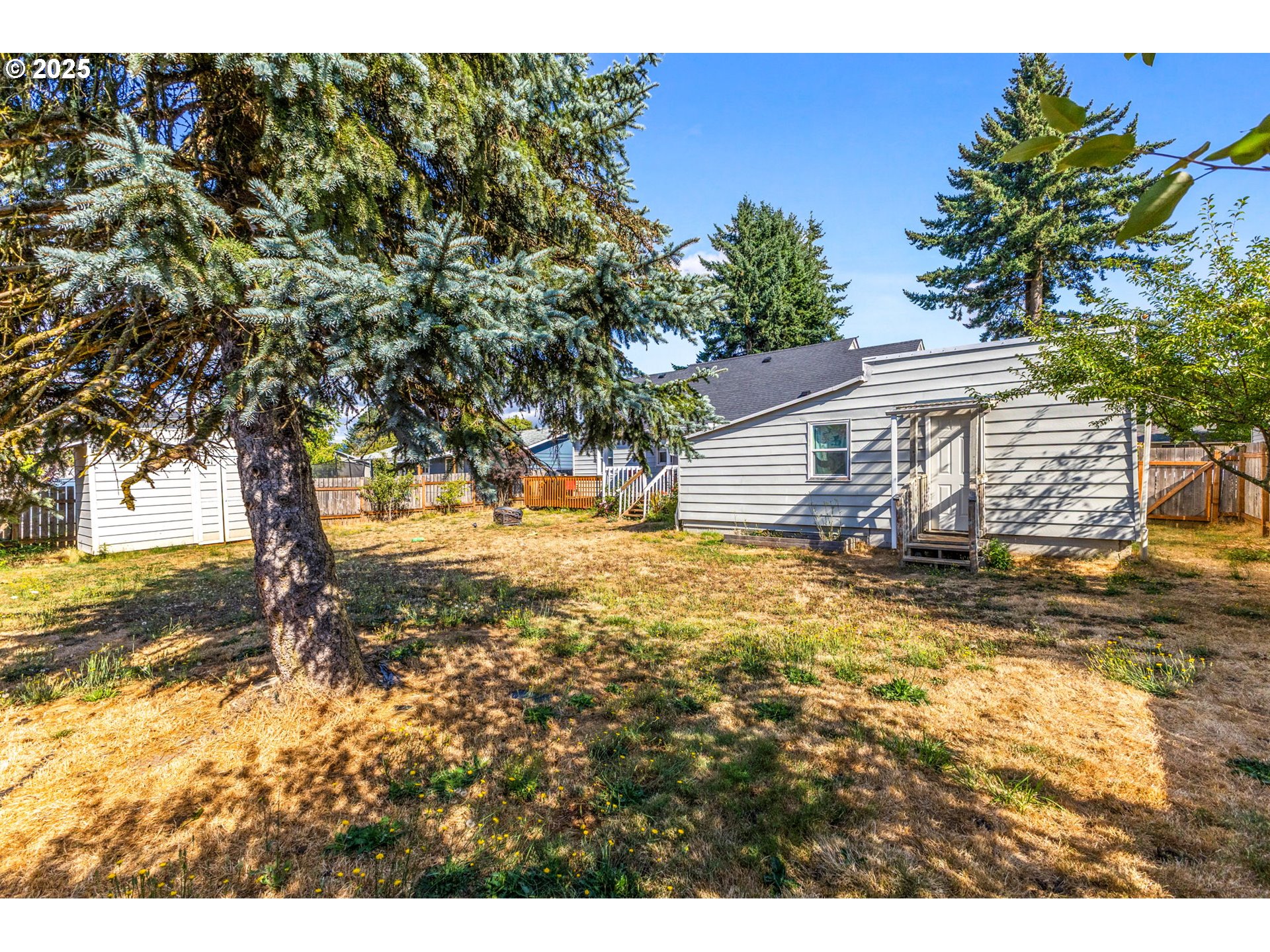 221 Southwest Rainbow Avenue Dallas, OR 97338 - Photo 34 of 36 a view of a yard with an outdoor space
