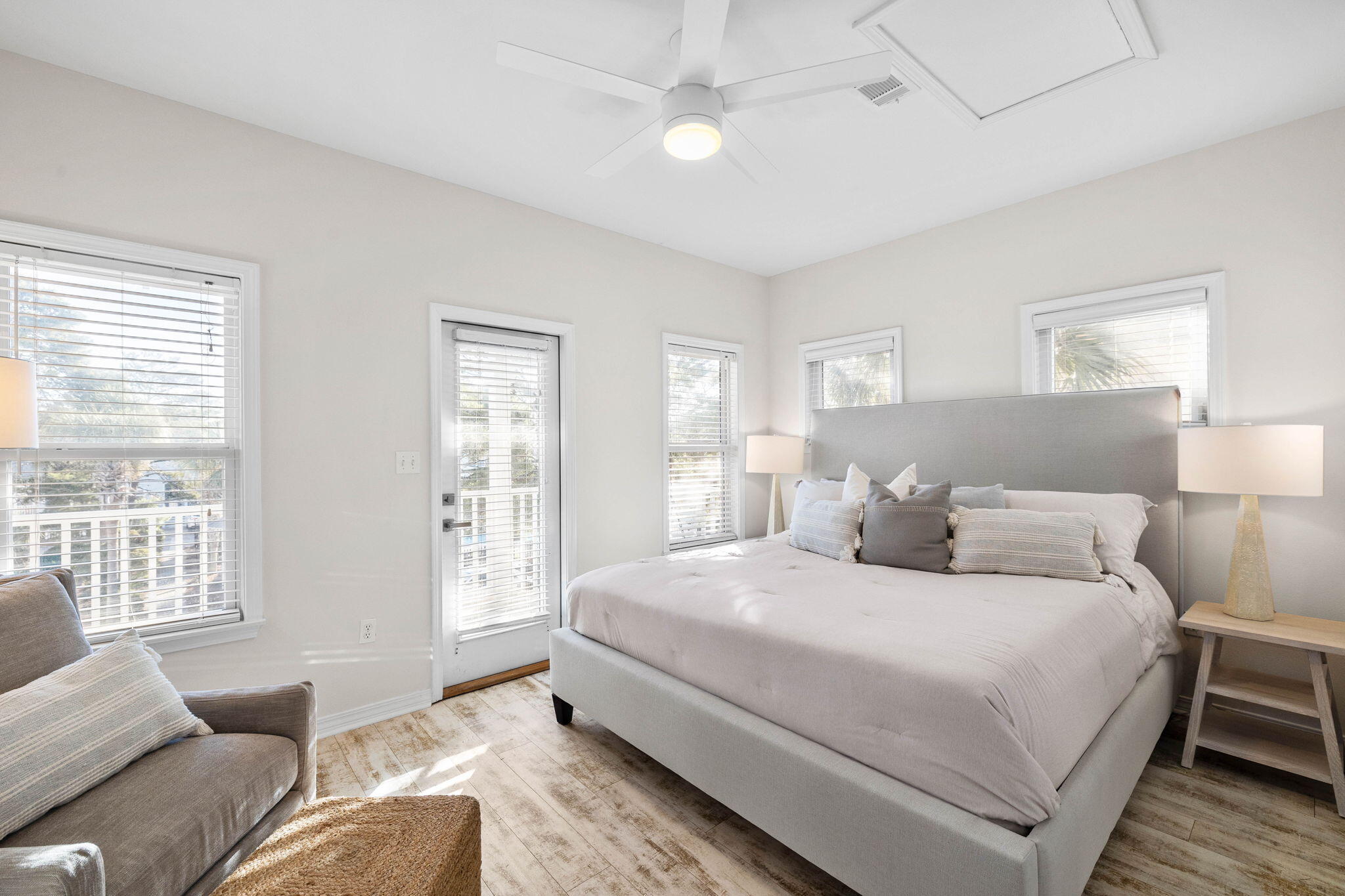 482 Hidden Lake Way Santa Rosa Beach, FL 32459 - Photo 30 of 51 a bedroom with a large bed couch and windows