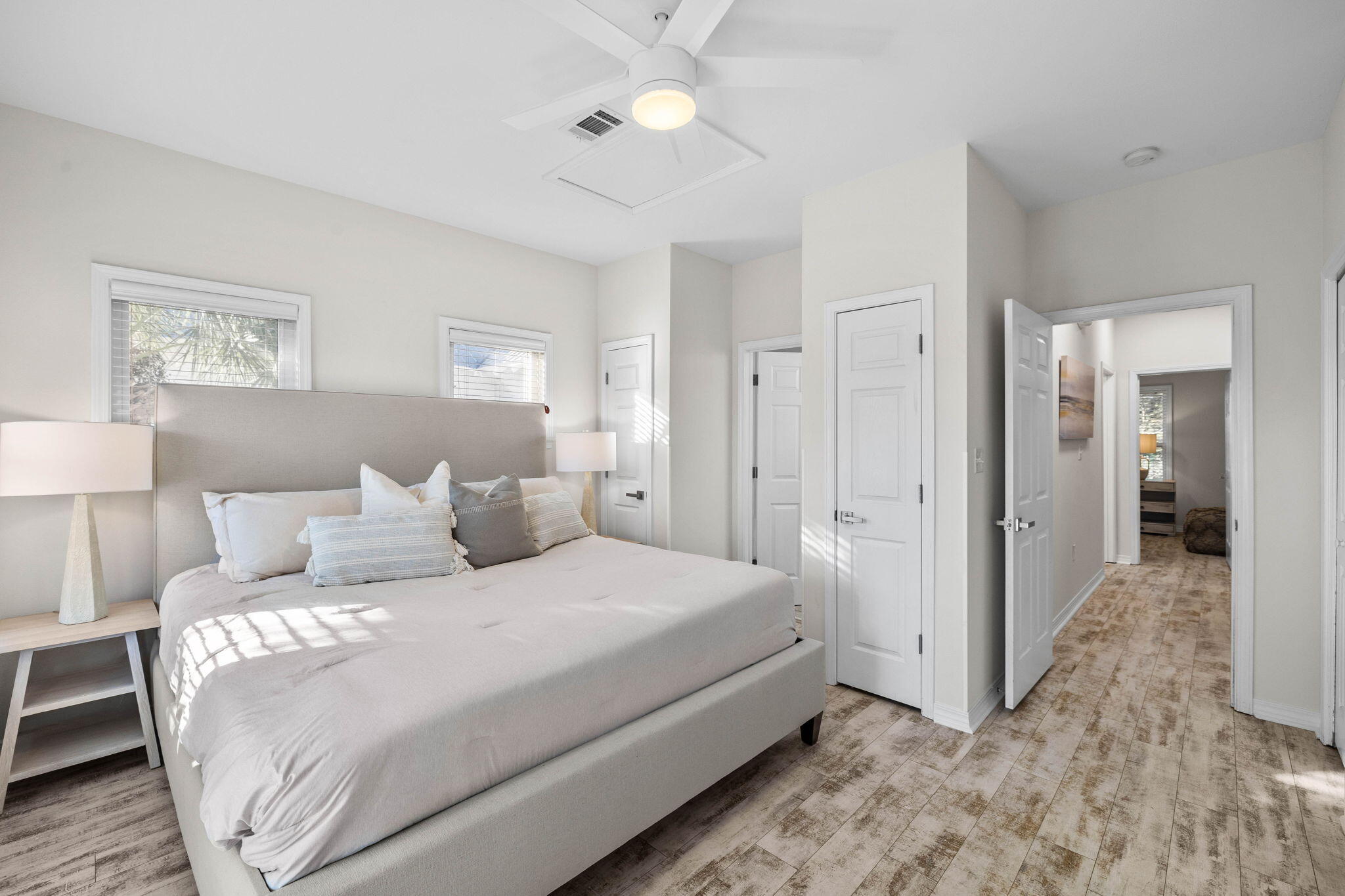 482 Hidden Lake Way Santa Rosa Beach, FL 32459 - Photo 31 of 51 a bedroom with a bed and a chandelier