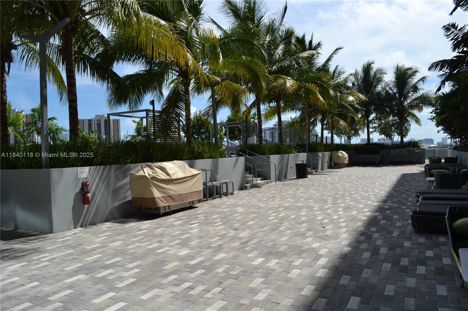 2960 Northeast 207th Street, Unit 1204 Aventura, FL 33180 - Photo 12 of 28 a view of outdoor space with trees