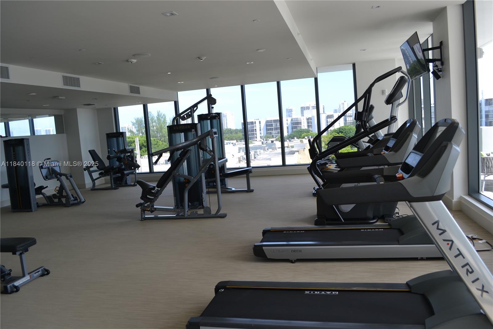 2960 Northeast 207th Street, Unit 1204 Aventura, FL 33180 - Photo 14 of 28 a view of a room with gym equipment