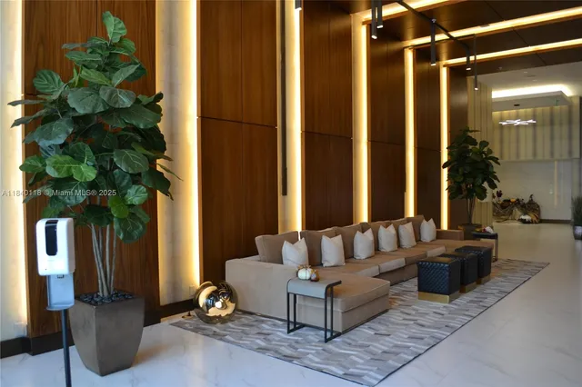 a living room with furniture and a potted plant