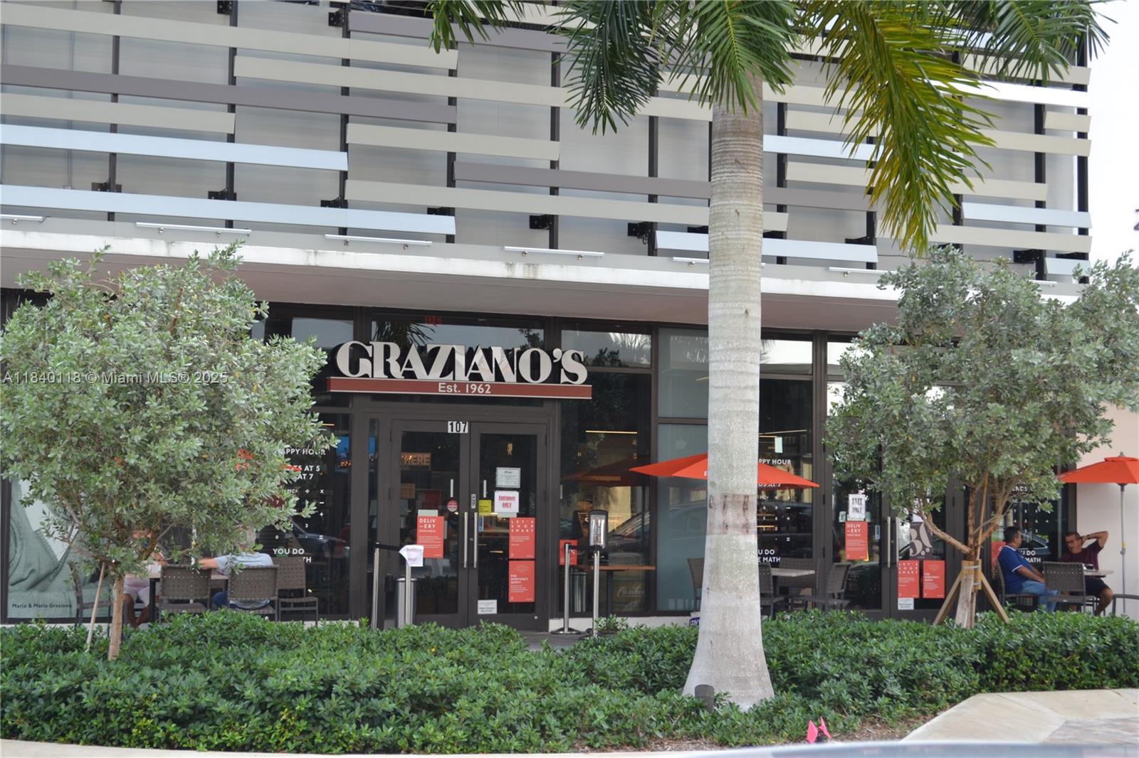 2960 Northeast 207th Street, Unit 1204 Aventura, FL 33180 - Photo 19 of 28 a front view of a building with outdoor area