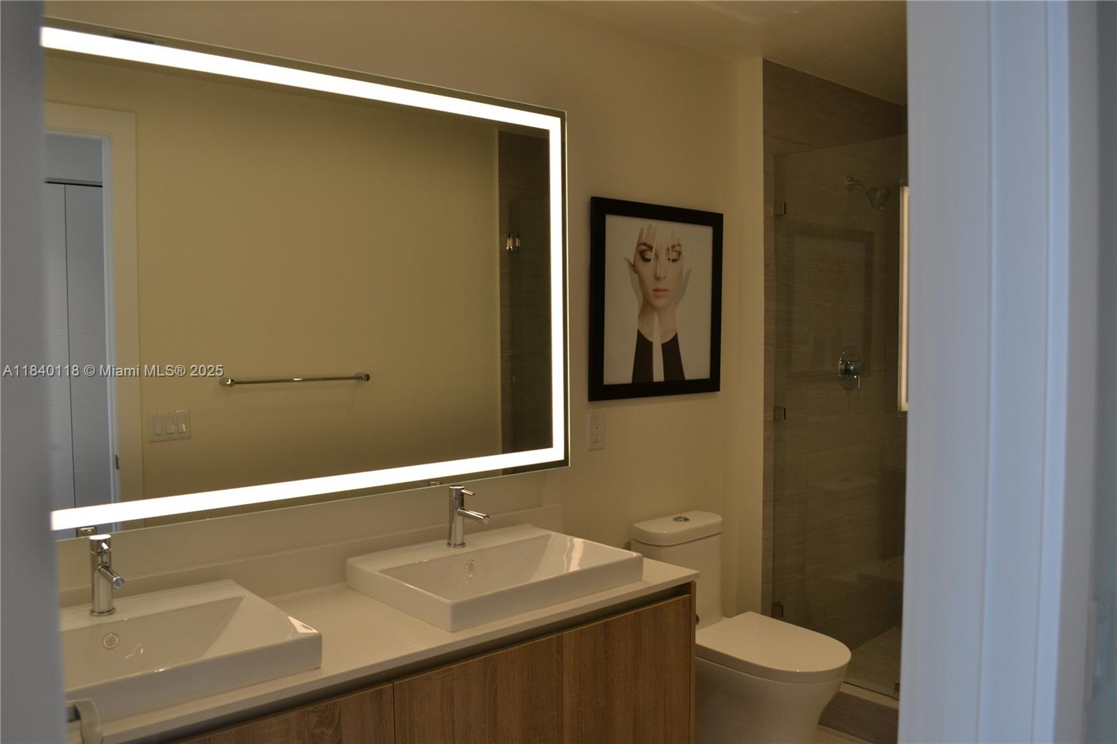 2960 Northeast 207th Street, Unit 1204 Aventura, FL 33180 - Photo 28 of 28 a bathroom with a sink a toilet and shower