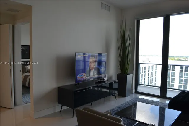 a living room with furniture and a window