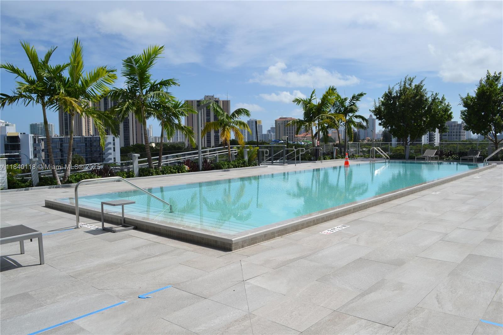 2960 Northeast 207th Street, Unit 1204 Aventura, FL 33180 - Photo 5 of 28 a view of swimming pool with outdoor seating