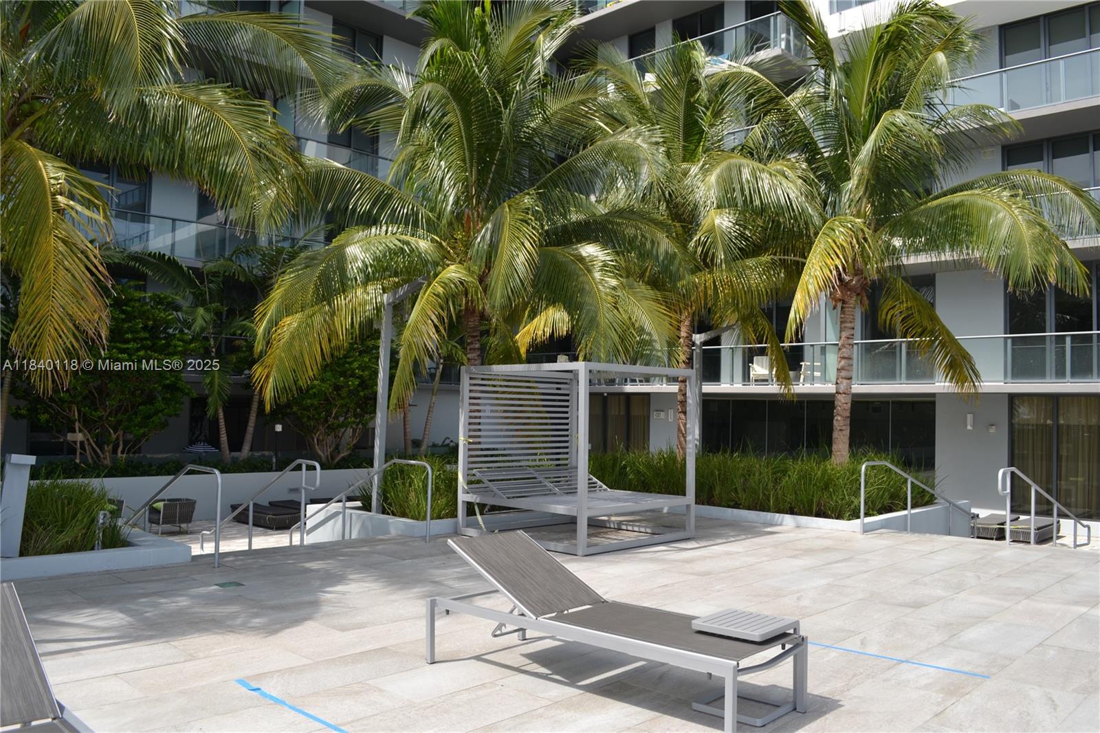 2960 Northeast 207th Street, Unit 1204 Aventura, FL 33180 - Photo 6 of 28 a view of a backyard with plants