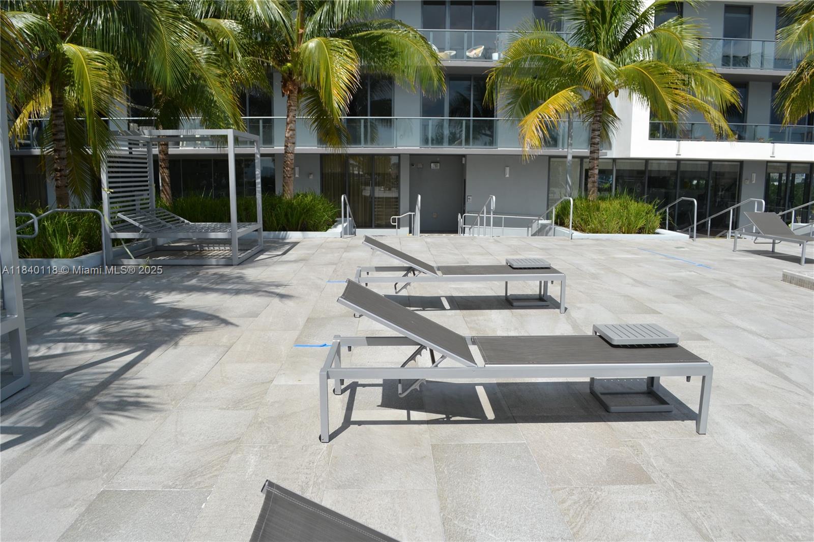 2960 Northeast 207th Street, Unit 1204 Aventura, FL 33180 - Photo 9 of 28 a view of outdoor space yard and swimming pool