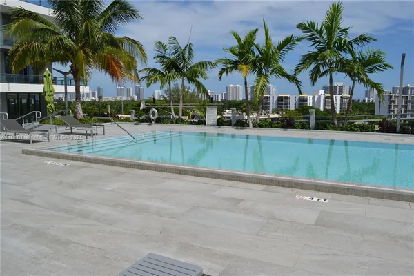 a view of outdoor space with palm trees