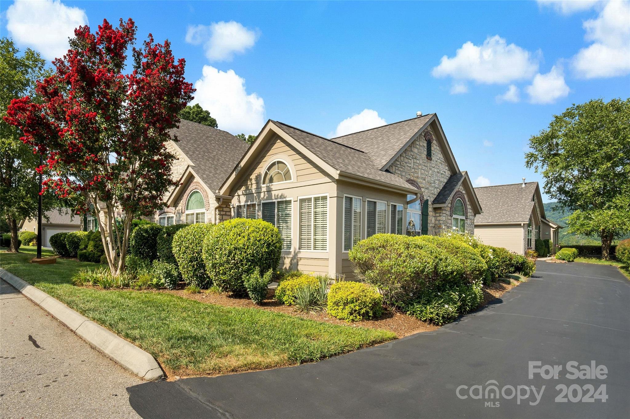46 Outlook Circle Swannanoa, NC 28778 - Photo 2 of 36 a front view of a house with garden