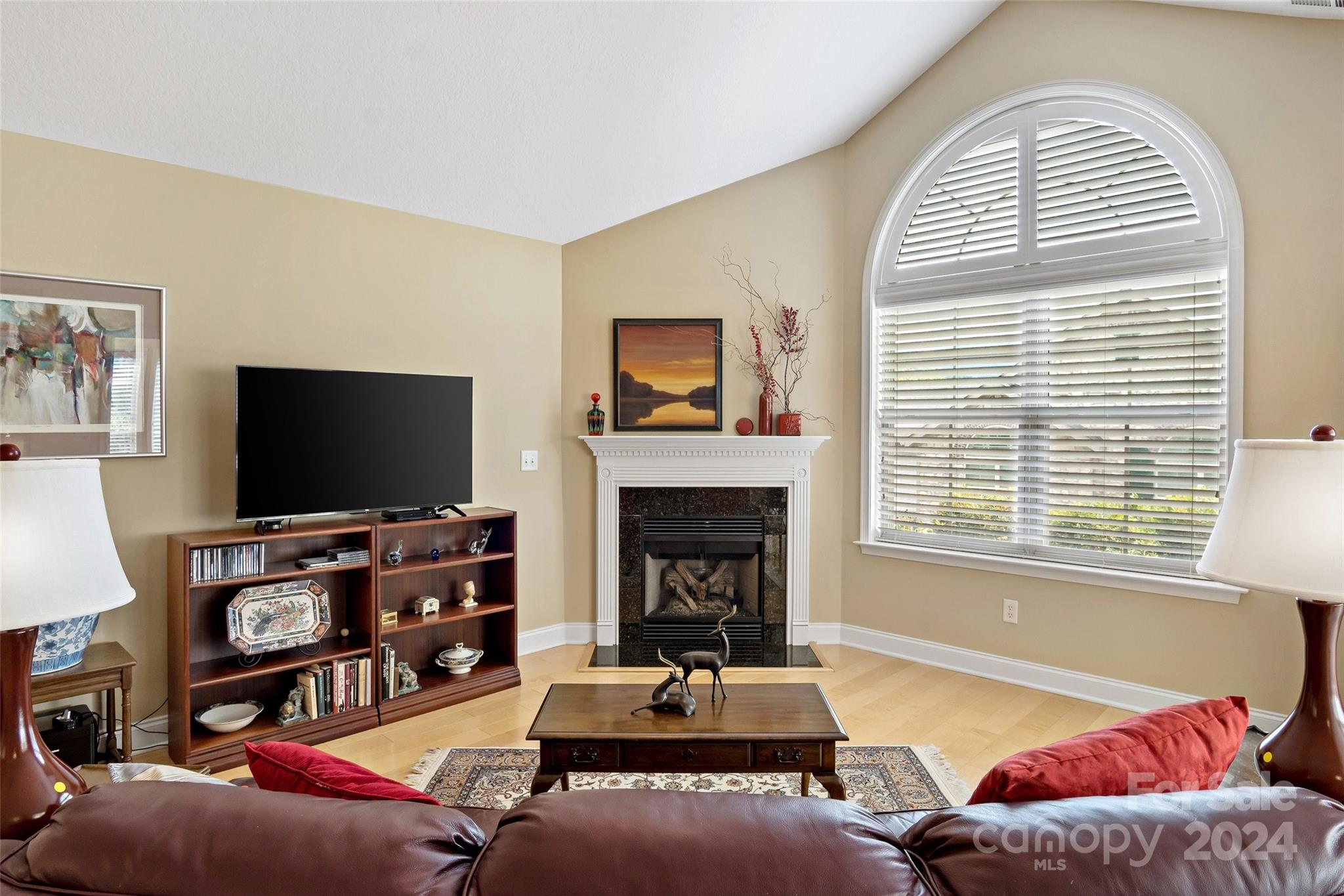 46 Outlook Circle Swannanoa, NC 28778 - Photo 9 of 36 a living room with furniture a flat screen tv and a fireplace