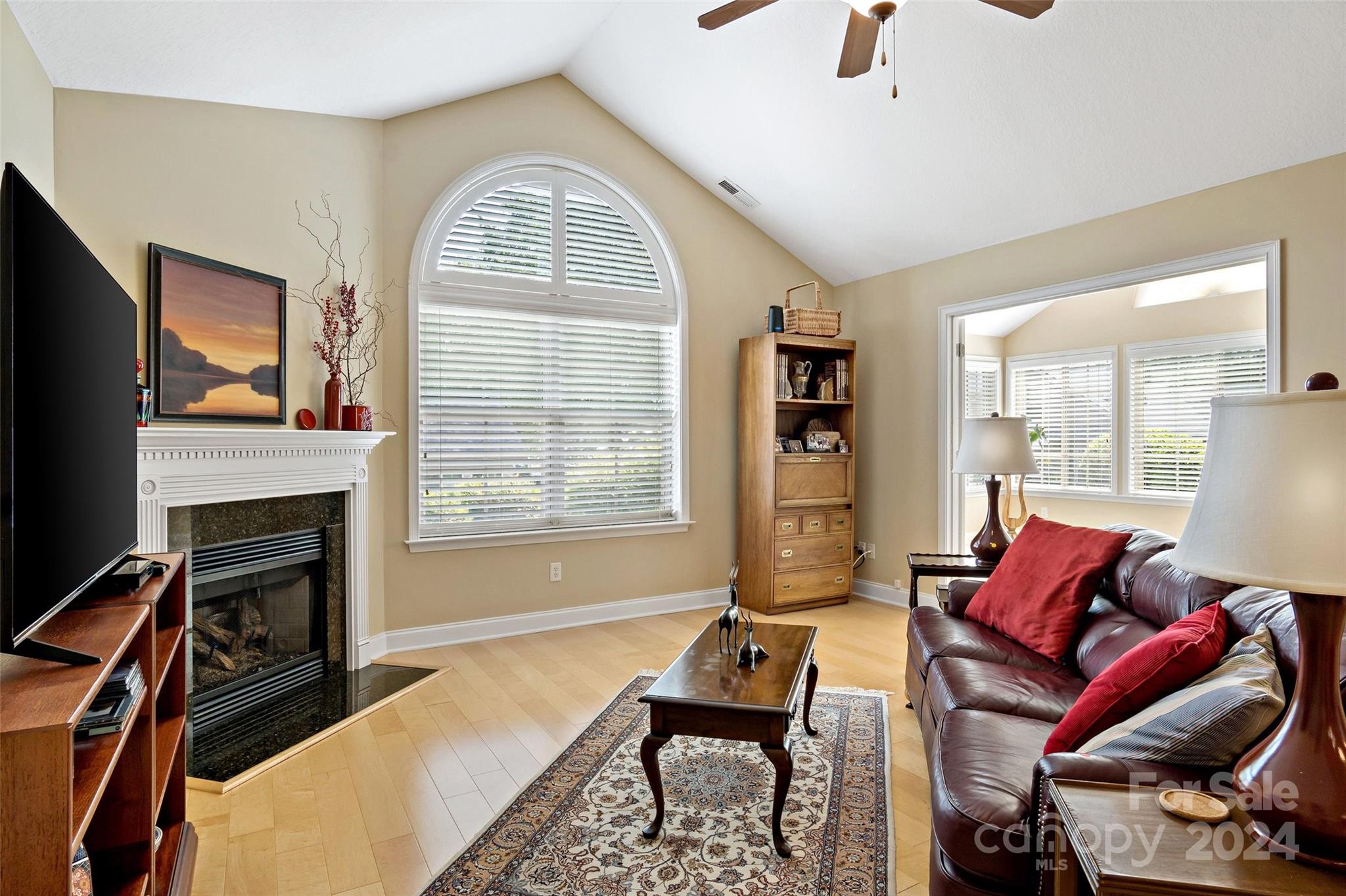46 Outlook Circle Swannanoa, NC 28778 - Photo 10 of 36 a living room with furniture a flat screen tv and a fireplace