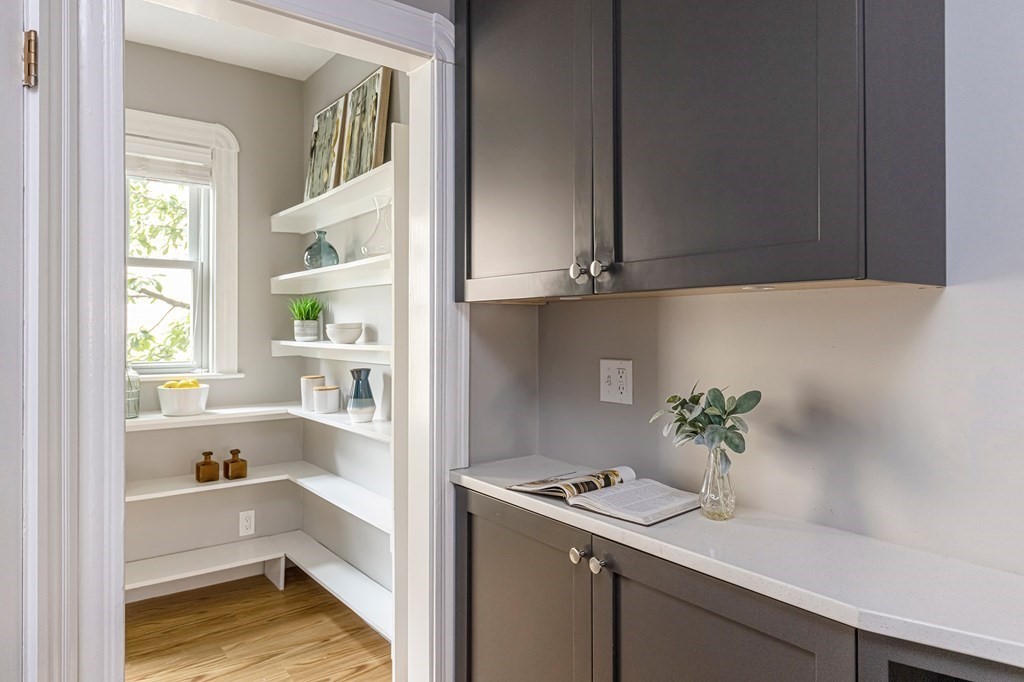 52-54 Gold Star Road Cambridge, MA 02140 - Photo 11 of 36 a room with a window and a potted plant on the counter