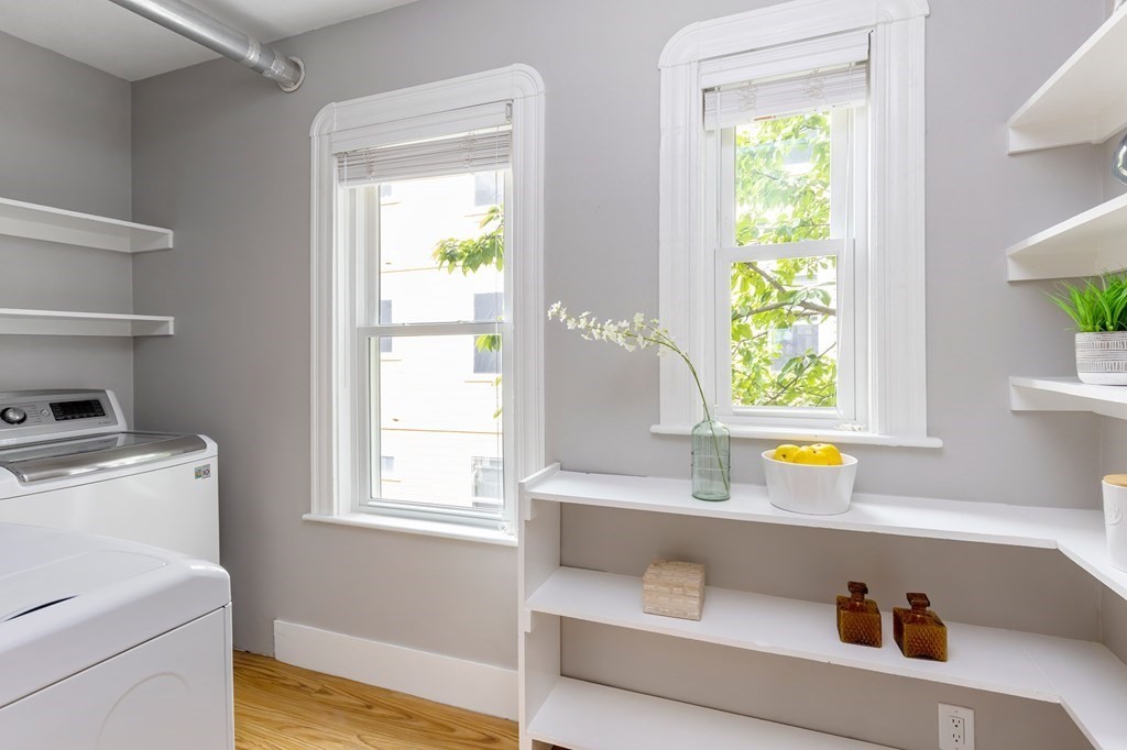 52-54 Gold Star Road Cambridge, MA 02140 - Photo 12 of 36 a view of kitchen with window and wooden floor