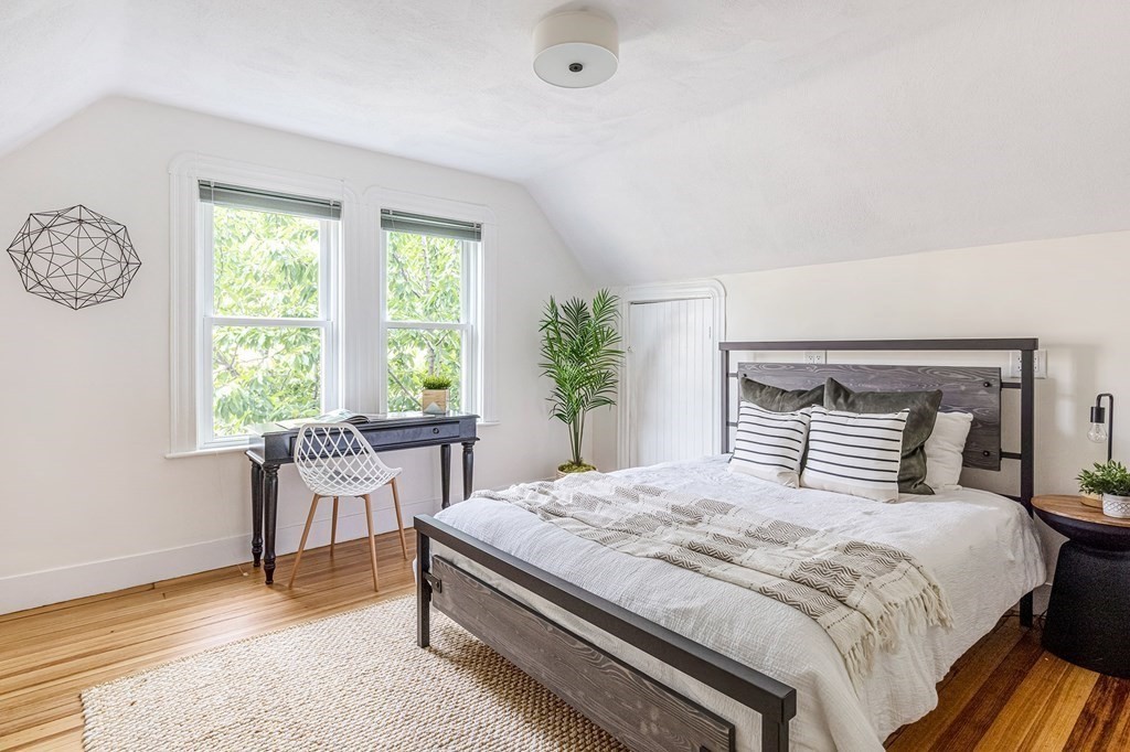 52-54 Gold Star Road Cambridge, MA 02140 - Photo 17 of 36 a bedroom with a large bed and a table