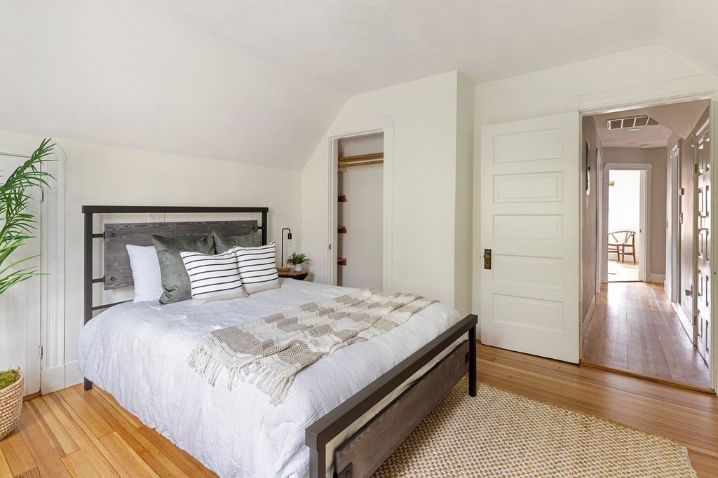 52-54 Gold Star Road Cambridge, MA 02140 - Photo 19 of 36 a bedroom with a bed and a mirror