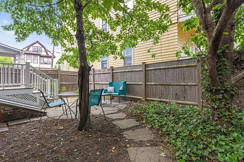 52-54 Gold Star Road Cambridge, MA 02140 - Photo 27 of 36 a view of a chair and table in backyard