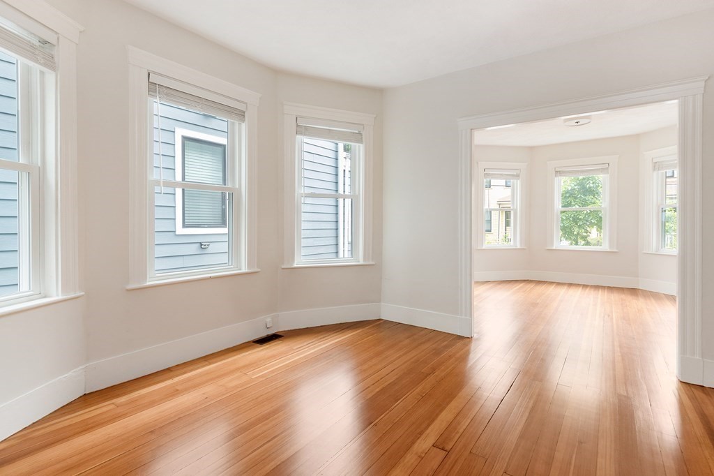 52-54 Gold Star Road Cambridge, MA 02140 - Photo 28 of 36 a view of empty room with wooden floor and fan