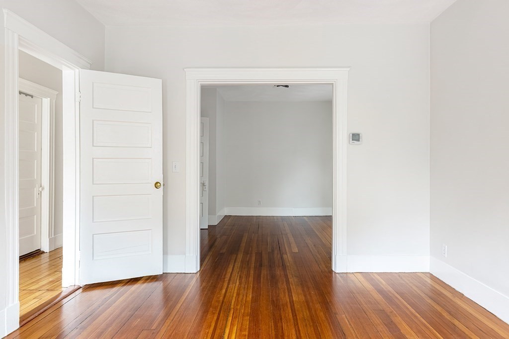 52-54 Gold Star Road Cambridge, MA 02140 - Photo 30 of 36 a view of a room with wooden floor and bench