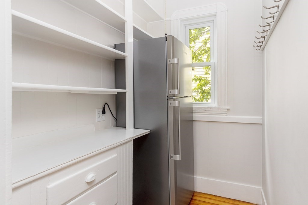 52-54 Gold Star Road Cambridge, MA 02140 - Photo 33 of 36 a kitchen with a refrigerator and window