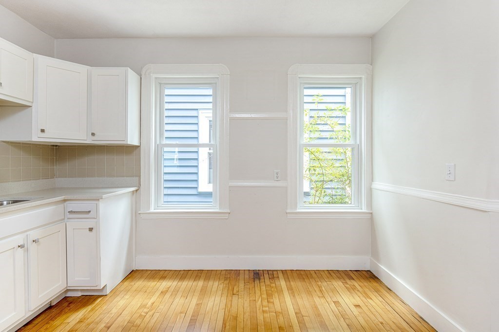 52-54 Gold Star Road Cambridge, MA 02140 - Photo 34 of 36 an empty room with wooden floor and a window