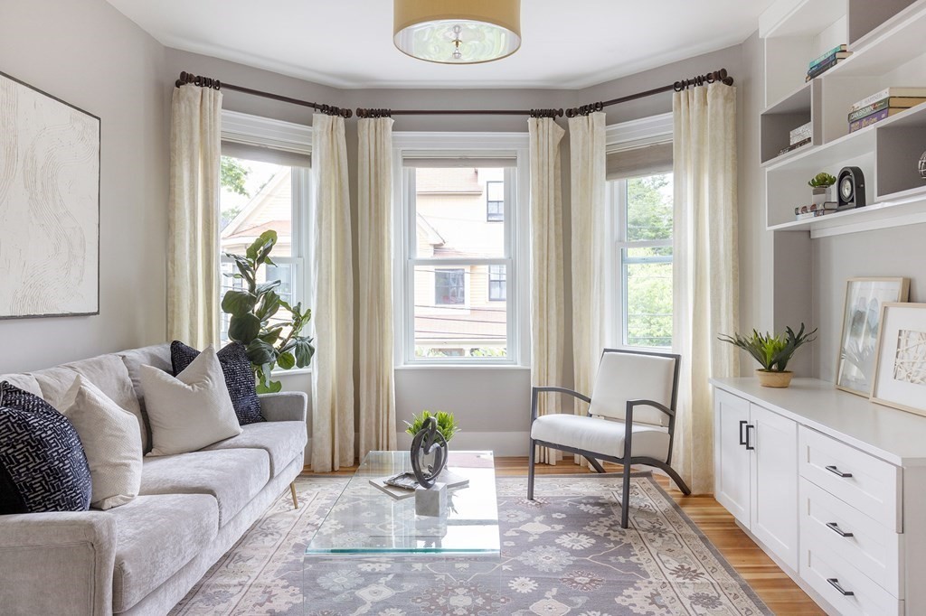 52-54 Gold Star Road Cambridge, MA 02140 - Photo 4 of 36 a living room with furniture and a large window