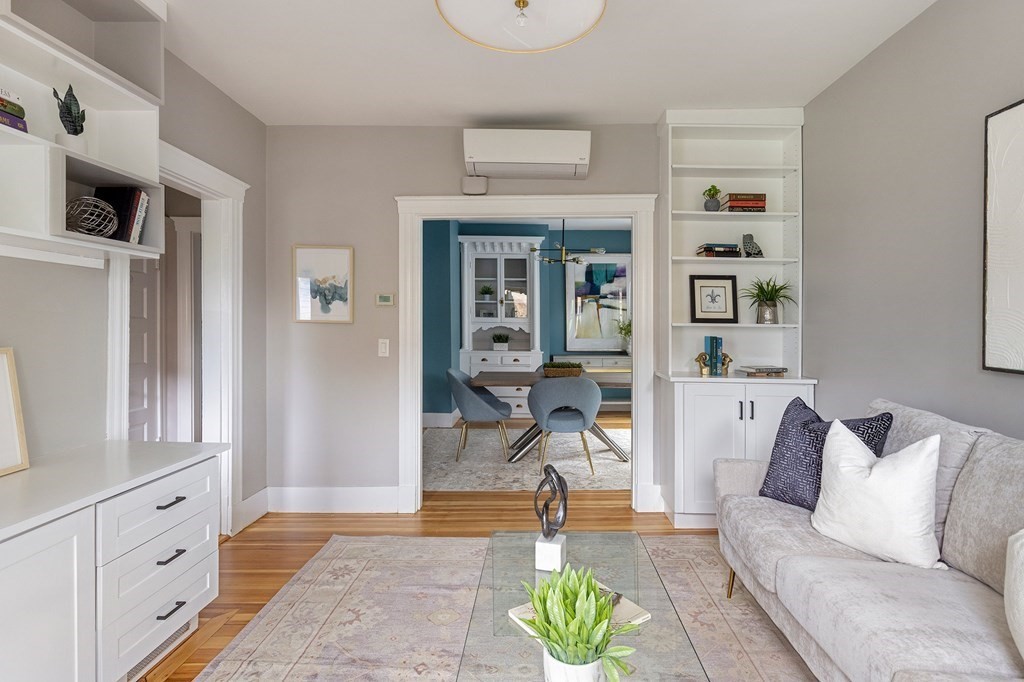 52-54 Gold Star Road Cambridge, MA 02140 - Photo 5 of 36 a living room with furniture a dining table and a chandelier