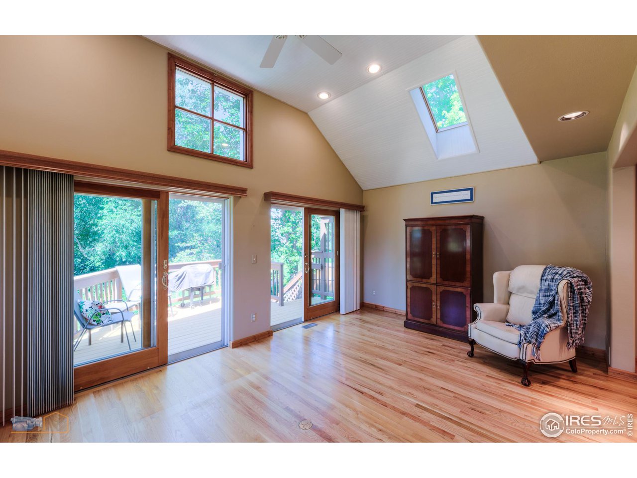 4477 Wellington Road Boulder, CO 80301 - Photo 11 of 36 Sunny and Bright Living Area w Skylight and Easy Access to Deck
