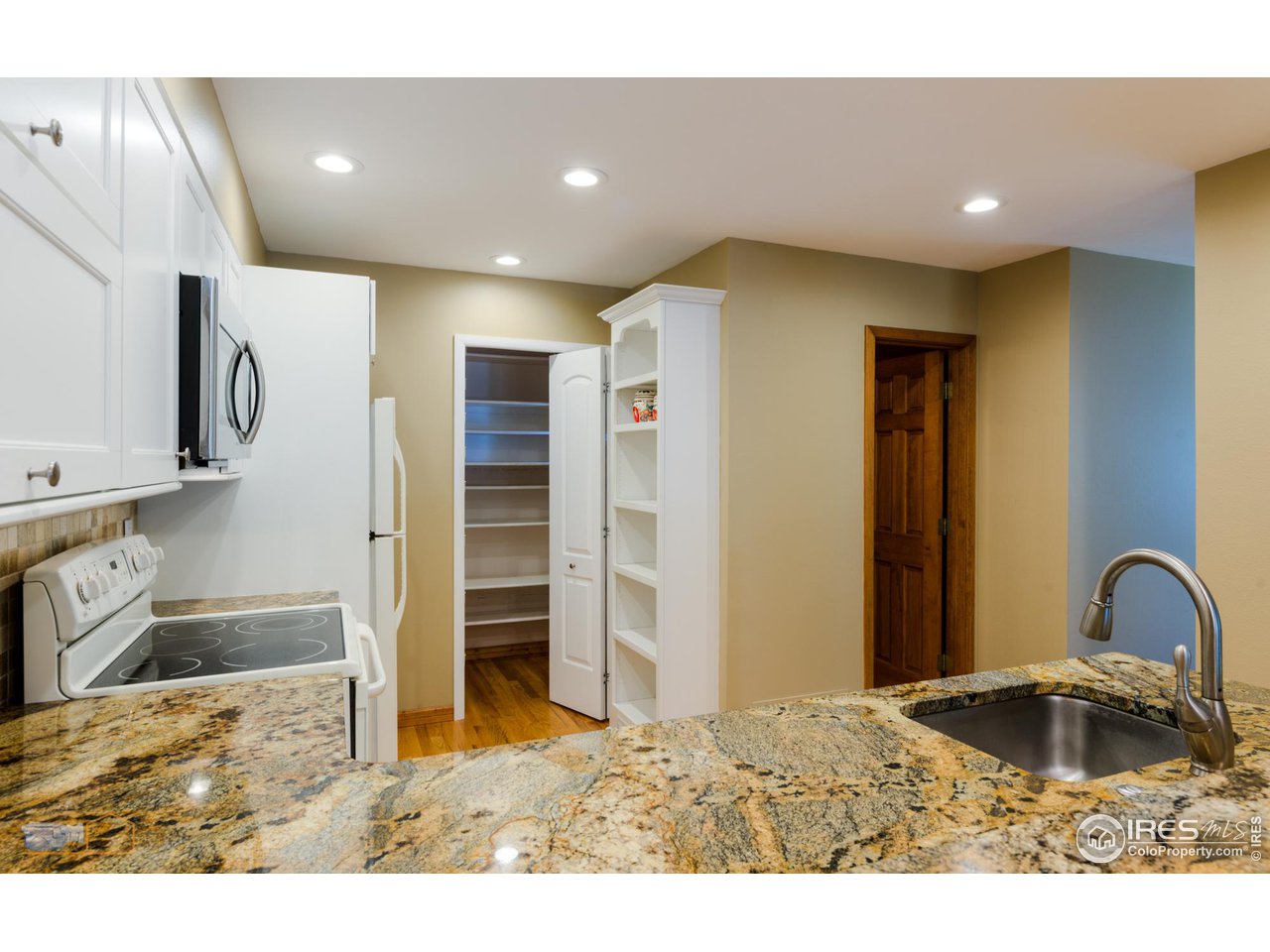 4477 Wellington Road Boulder, CO 80301 - Photo 14 of 36 Pantry and Granite Countertops