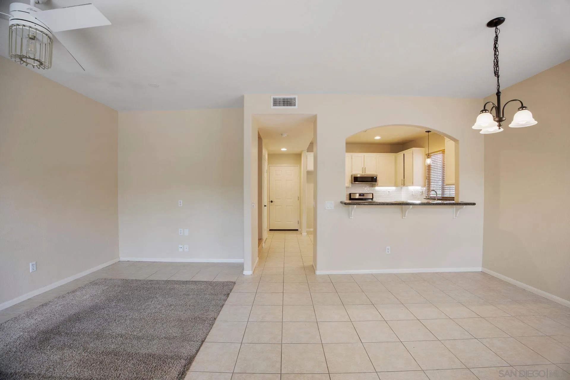 4058 Craven Road, Unit 53 Oceanside, CA 92057 - Photo 11 of 31 a view of a kitchen with a cabinet and chandelier