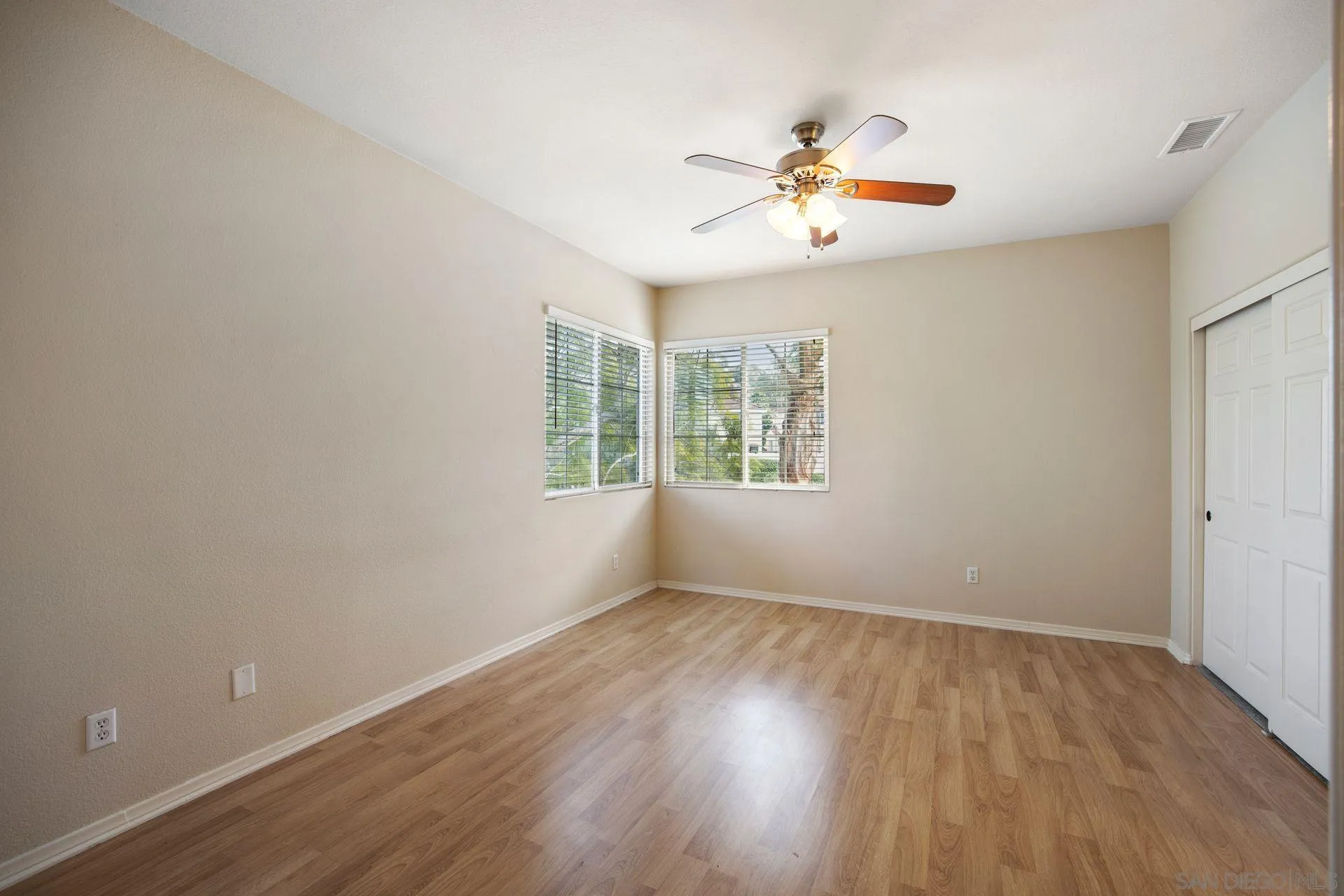 4058 Craven Road, Unit 53 Oceanside, CA 92057 - Photo 19 of 31 wooden floor in an empty room with a window