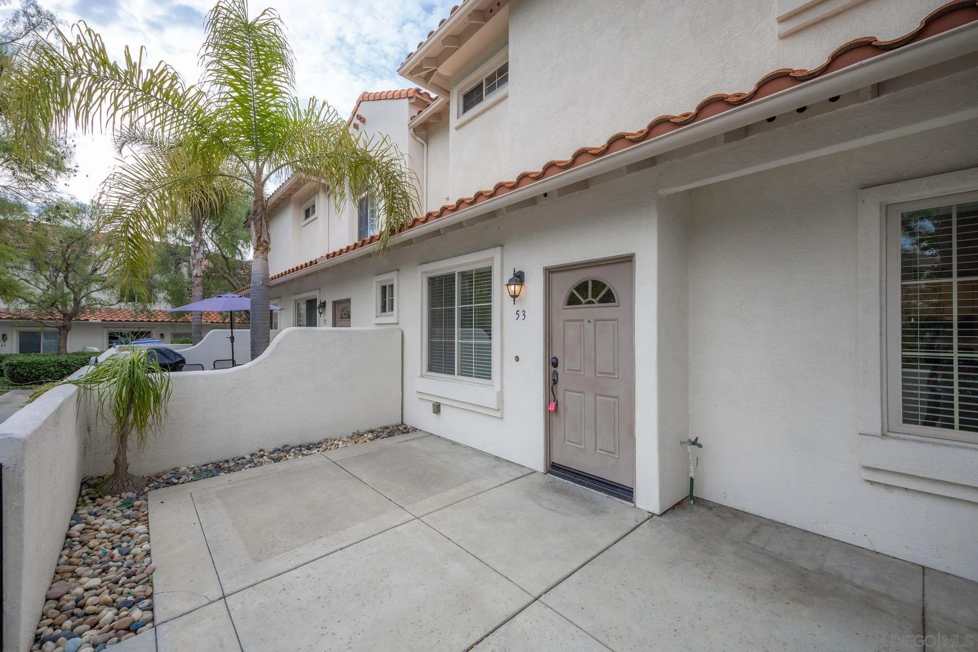 4058 Craven Road, Unit 53 Oceanside, CA 92057 - Photo 6 of 31 a view of a house with backyard and sitting area