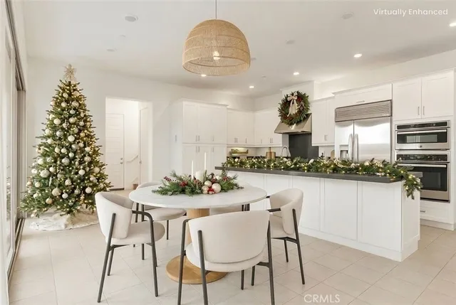 a kitchen with a table and chairs in it