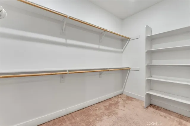 a view of an empty walk in closet