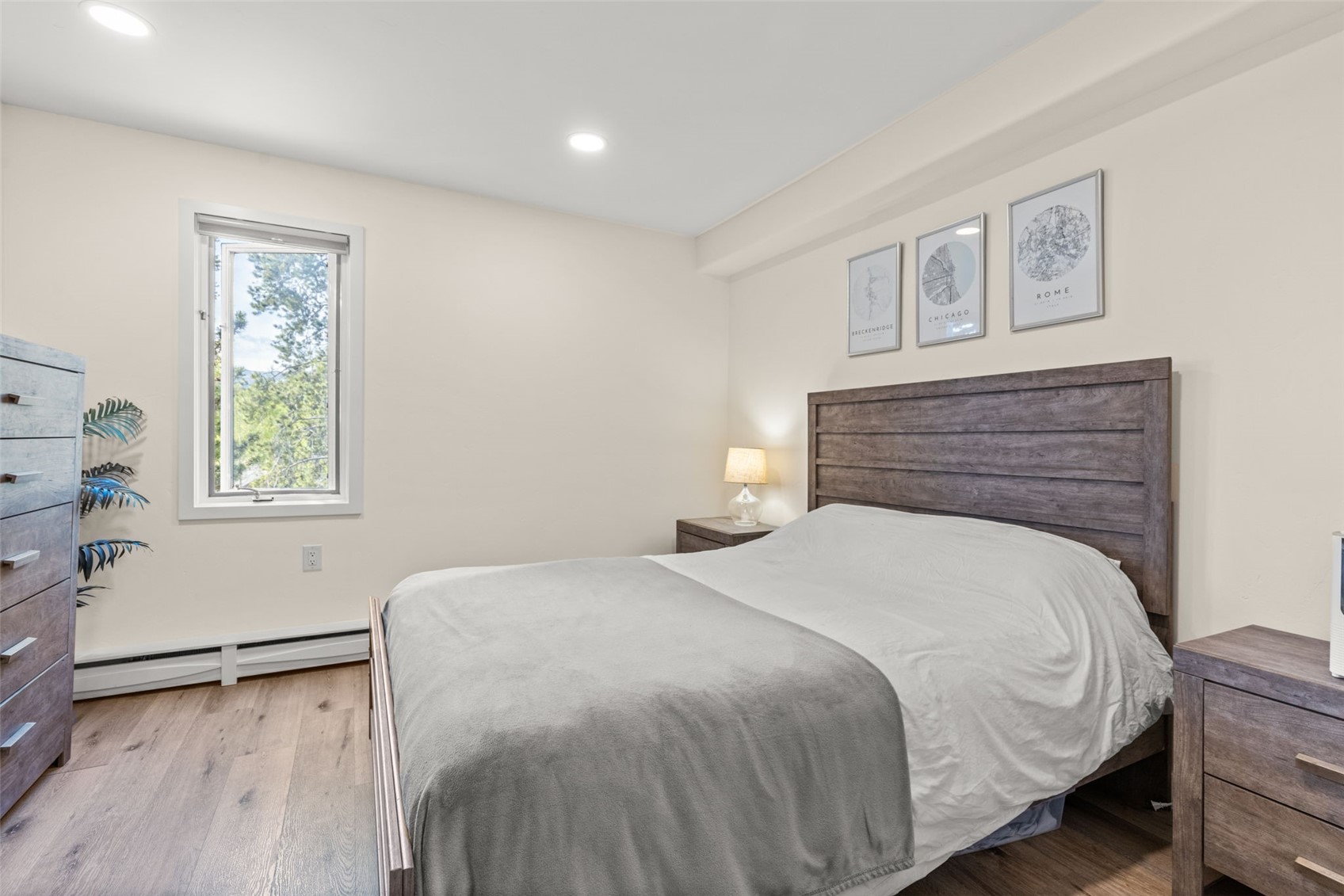 1127 Ski Hill Road, Unit 104 Breckenridge, CO 80424 - Photo 20 of 32 a bedroom with a bed and a window
