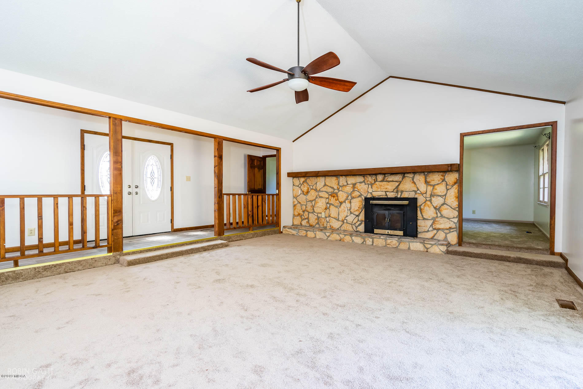 6251 Stapleton Road Macon, GA 31206 - Photo 5 of 21 an empty room with fireplace and fan