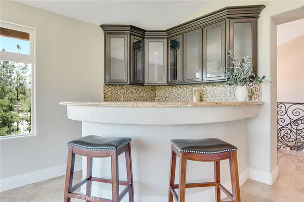 a kitchen with stainless steel appliances granite countertop a sink and a stove