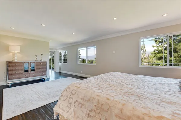 a bedroom with two beds and a chandelier