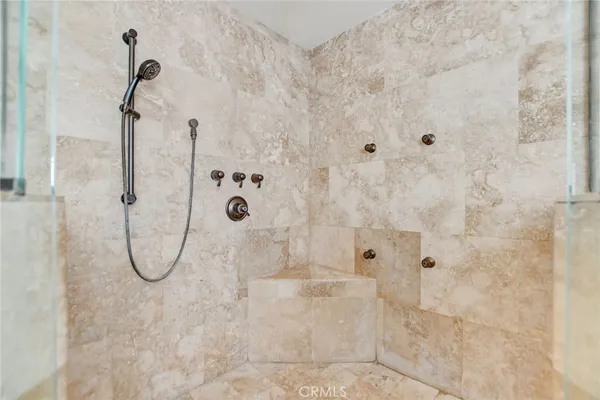 a view of a house with a yard and potted plants