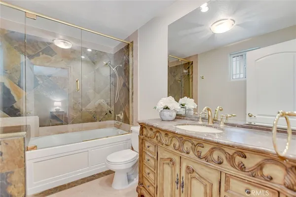 an aerial view of a house with garden space and street view