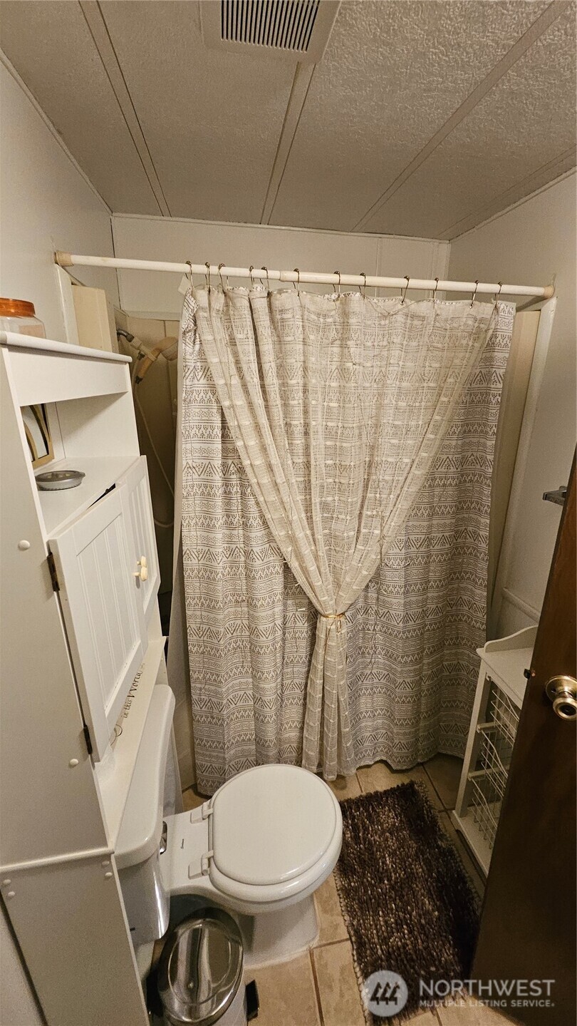 5600 Mt Solo Road, Unit 161 Longview, WA 98632 - Photo 17 of 17 a bathroom with a sink and a toilet